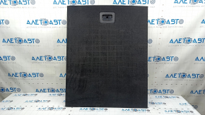 The trunk floor of a BMW X3 F25 11-17 is black and has an organizer. The handle is broken and there are scratches on the handle.