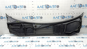 The plastic windshield wiper grille on an Audi A6 C8 19-24 has a broken mount.