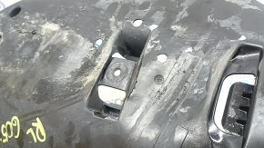 The rear lower control arm trim, left, BMW X5 G05 19-24, is torn and dented.