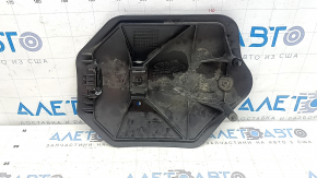 The rear lower control arm trim, right BMW X5 G05 19-24, is torn and dented.