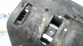 The rear lower control arm trim, right BMW X5 G05 19-24, is torn and dented.