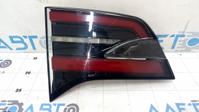 The left inner tailgate light on a Tesla Model X 22-25 is worn.