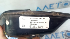 The right inner tailgate light for the Tesla Model X 22-25 is worn.