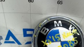 The BMW X3 F25 11-17 trunk lid emblem has broken guides.