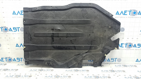 The rear left underbody protection of a BMW X5 G05 19-24 is dented and cracked.