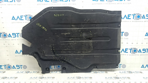 The rear left underbody protection of a BMW X5 G05 19-24 is dented and cracked.