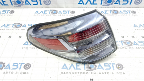 Left outer fender light for a Lexus RX450h 10-12 pre-restoration model, scratches