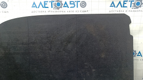 The trunk floor of a 2023-2024 Honda Accord is black and has tears in it. It needs cleaning.