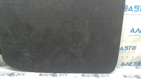 The trunk floor of a 2023-2024 Honda Accord is black and has tears in it. It needs cleaning.