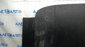 The trunk floor of a 2023-2024 Honda Accord is black and has tears in it. It needs cleaning.