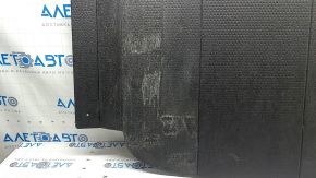The trunk floor of a 2023-2024 Honda Accord is black and has tears in it. It needs cleaning.