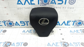 The driver's side airbag in the steering wheel of a Lexus RX350 RX450h 10-12 pre-restyling is black, the chrome is peeling, and there are scratches.