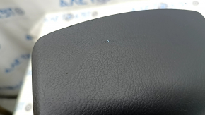 The driver's side airbag in the steering wheel of a Lexus RX350 RX450h 10-12 pre-restyling is black, the chrome is peeling, and there are scratches.