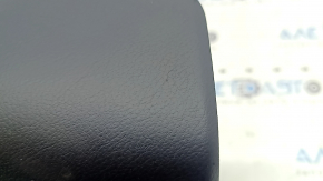 The driver's side airbag in the steering wheel of a Lexus RX350 RX450h 10-12 pre-restyling is black, the chrome is peeling, and there are scratches.