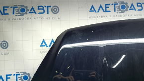 The hood of a Ford Escape MK3 2017-2019 is bare and black, with scratches and scuffs.