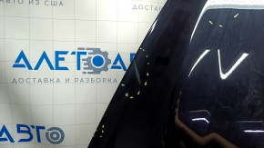 The hood of a Ford Escape MK3 2017-2019 is bare and black, with scratches and scuffs.