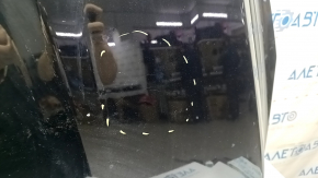 The hood of a Ford Escape MK3 2017-2019 is bare and black, with scratches and scuffs.