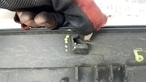 The lower inner front right door trim for the Lexus RX350 RX450h 10-15 has broken fasteners.