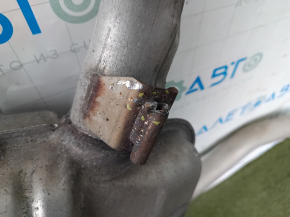 The exhaust line, middle part with a barrel, Jeep Grand Cherokee WL 22-25 PHEV for 2 exhausts, is dented, brackets are broken off