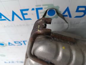 The exhaust line, middle part with a barrel, Jeep Grand Cherokee WL 22-25 PHEV for 2 exhausts, is dented, brackets are broken off