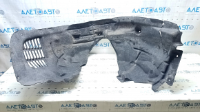 The front left fender liner of a Jeep Grand Cherokee WL 21-25 type 2 is torn, missing a fragment.