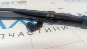 The right windshield wiper arm on a Tesla Model Y 20-25 is broken.