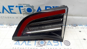 Tesla Model 3 18 right trunk lid interior light, type 2 scratches