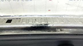 Audi Q3 83A 19-25 trunk opening trim, black with chrome, scuffs on chrome and plastic, broken fastener