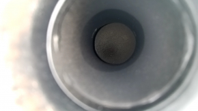 The exhaust pipe, middle section with a catalytic converter, Lexus RX400h 06-09, is dented and rusty.
