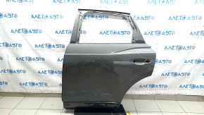 Bare rear left door of Audi Q3 83A 19-25 silver LX7G, dented