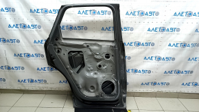 Bare rear left door of Audi Q3 83A 19-25 silver LX7G, dented