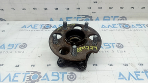 The rear left hub of a Lexus RX300 RX330 RX350 RX400h 04-09 AWD is rusty.