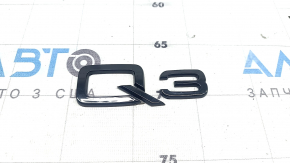 Q3 emblem on the tailgate of the Audi Q3 83A 19-25, glossy black