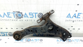 The lower front left control arm of a Lexus RX300 RX330 RX350 RX400h 04-09 has a torn silent block and is rusty.