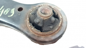 The lower front left control arm of a Lexus RX300 RX330 RX350 RX400h 04-09 has a torn silent block and is rusty.