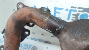 The front exhaust manifold with a catalytic converter for a Lexus RX400h 06-09 is rusty and has a broken stud.