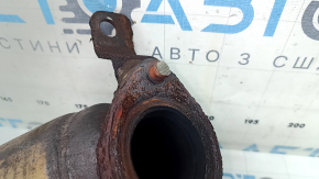 The front exhaust manifold with a catalytic converter for a Lexus RX400h 06-09 is rusty and has a broken stud.