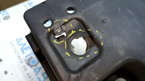 The right fuel tank guard for a Toyota Prius 50 19-22 AWD has a torn mount.