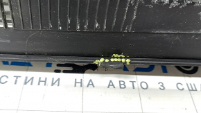 The plastic windshield wiper grille on a Chrysler Pacifica 17-24 has a broken mount.