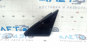 Triangle plug for the front left door of an Audi Q3 83A 19-25, glossy black, scratches