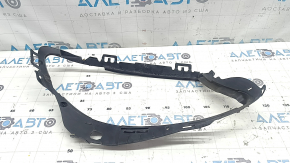 The front left headlight seal for a Mercedes W213 E 17-20 has a broken mount.