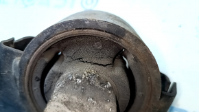 The rear left longitudinal control arm of a Lexus RX350 RX450H 10-15 has a torn silent block and is rusty.