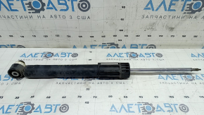 The rear left shock absorber of the Audi Q3 83A 19-25 is dented.