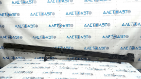The left door sill guard for an Audi Q7 16-25 is worn and cracked.