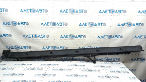 The left door sill guard for an Audi Q7 16-25 is worn and cracked.