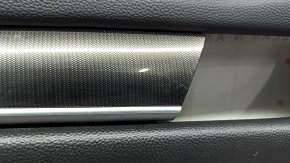 Front left door panel for a 2020 Honda Accord, black leather, carbon fiber insert with chrome molding, scratches, needs cleaning