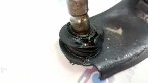 The front right lower control arm of a Mazda 3 19-23 Mexico-built model has a torn boot.
