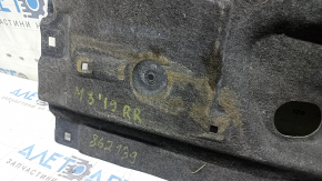The rear right underbody protection of the Mazda 3 19-24 FWD Mexico built is worn.