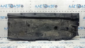 Front left underbody protection for Mazda 3 19-24 is worn and dented.