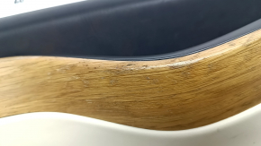Tesla Model X 16-21 front left door panel, black and beige leather, light wood molding, tears and nicks in the leather, scratches, dents